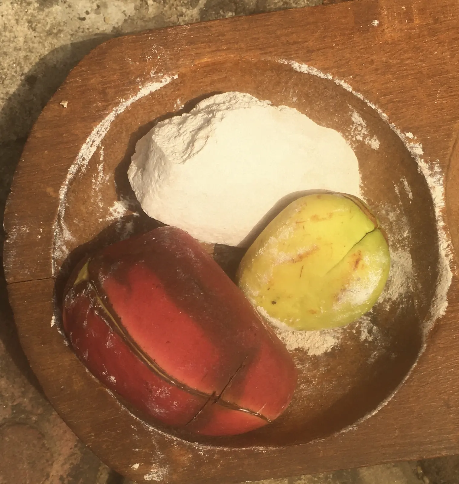 Ọkwa ọjị, a carved kola bowl with kola nuts and nzu